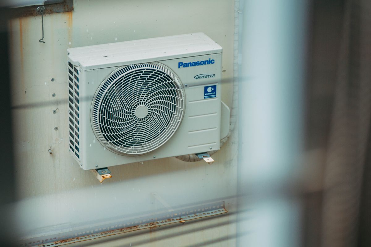 Outdoor split air-conditioning condenser installed on a wall